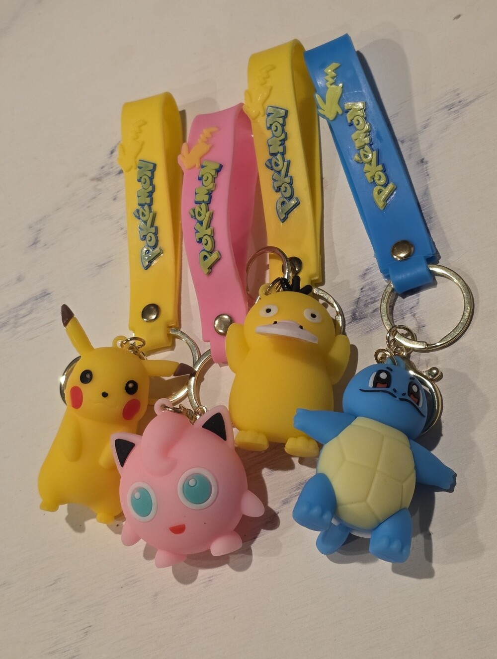 Set of 4- 3D silicone Pokémon keychains - Pikachu Jigglypuff Psyduck Squirtle